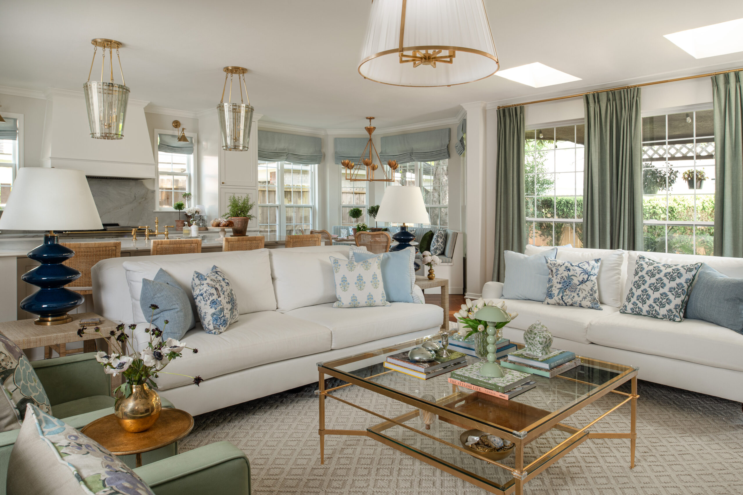 Wide-angle of the living room looking into the kitchen, one of the standout home renovation photos from this shoot, showing off the layered textures and natural palette.